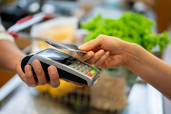 Paying for groceries with a Bank of Marion debit card.