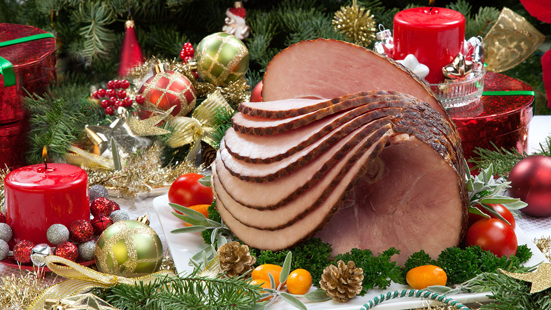 Picture of a Spiral Sliced Ham on dinner table.
